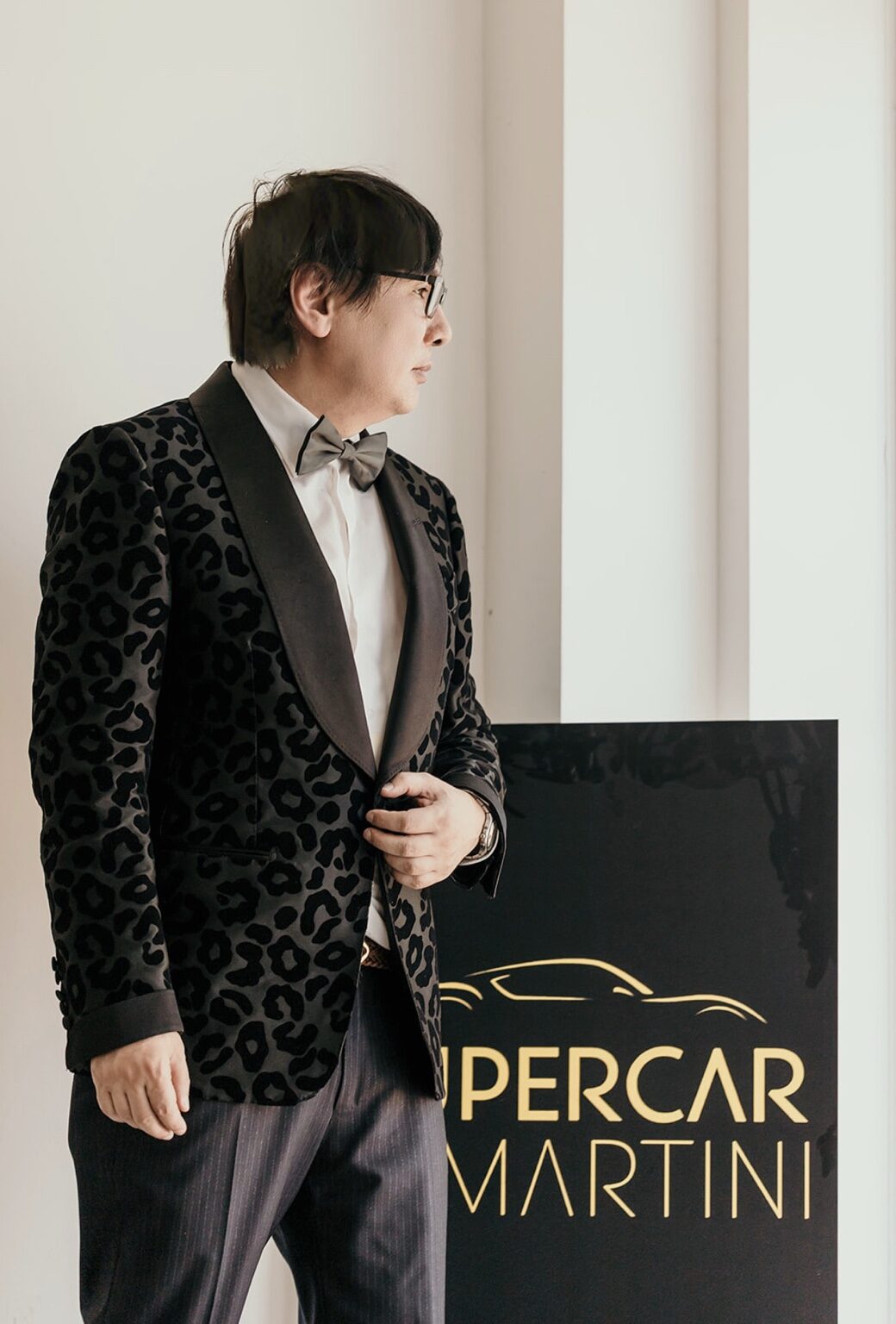 Supercar Martini Circle host in formal evening attire