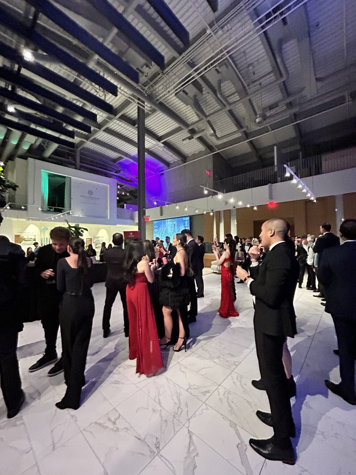 Guests gathered at a Supercar Martini Circle event