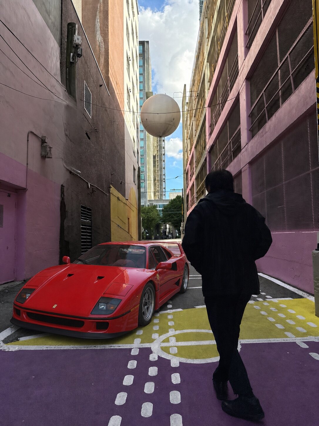Ferrari F40 and a gentleman in a colourful alley